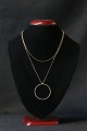 Elegant and 
timeless 
necklace in 
gold-plated 925 
sterling 
silver, with a 
nice circular 
pendant. ...