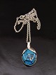 Sterling silver 
pendant 3.4 x 2 
cm. with 
turquoise and 
sterling silver 
chain 46 cm. 
Item No. 577072