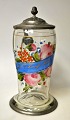German drinking 
mug, 1862. 
Glass decorated 
with enamel 
colors in the 
form of flowers 
and ...