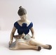 Bing & 
Grondahl. 
Porcelain 
figure. Sitting 
girl with cat. 
Model 2329. 
Height 12 cm. 
(1 quality)