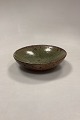 Olive green 
Stoneware Bowl. 
Smooth glaze 
inside. Rough 
brownish glaze 
on the outside. 
Artist ...