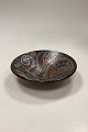 Stoneware Bowl 
in shades of 
brown, yellow 
and blue with 
hole for wall 
hanging. Artist 
unknown. ...