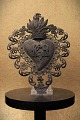 Decorative, old 
votive heart EX 
VOTO in silver 
from around 
1850 with a 
very fine 
patina. 
23x17cm.
