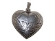 Sterling silver 
heart pendant.
Hallmarked 
"925S". 
Measures 2.2 
by 2.0 cm.
Excellent ...