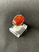 A silver ring 
with amber, 
made of 
sterling 
silver, Amber's 
warm colors and 
unique patterns 
...