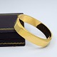 Rectangular 
bangle in 14k 
gold.
The bangle can 
be opened.
Inner measure: 
5,9 cm x 5,2 
...