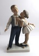 Lyngby. 
Porcelain 
figure. Girl 
and boy. Model 
93. Height ...
