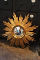 Decorative, old 
French sun 
mirror in 
gilded wood 
with a very 
fine patina. 
Dia.: 68cm. 
Mirror ...