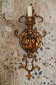 A pair of old 
French wall 
candlesticks in 
gilded metal 
and candle 
holder in 
gilded wood. 
H: ...