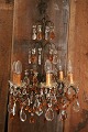 Old French 
prism 
chandelier with 
lots of clear 
and amber 
colored glass 
prisms. H: 
58cm. Dia.: ...