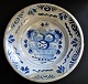 Large faience 
dish - Makkum, 
18th century. 
The 
Netherlands. 
Deep. 
Blue/white 
decorated. 
Mirror ...