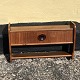 Small shelf 
with drawer in 
teak veneer. 
Danish modern 
from the 1960s. 
Small color 
difference on 
...