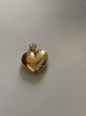 Beautifully 
executed gold 
heart, with a 
simple pattern 
in 14 carat 
gold. This 
small pendant 
is ...