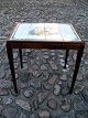 A mahogany tile 
table H.62cm. 
top 60x47cm.