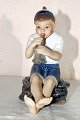 Boy with 
trumpet Dahl 
Jensen 
porcelain 
figurine. DJ  
Boy with 
trumpet, no. 
1218. height 
14.5 cm. ...