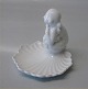 Dahl Jensen 
1099 Girl on a 
shell 8 x 9 cm 
Marked with the 
Royal Crown and 
DJ Copenhagen. 
In nice ...