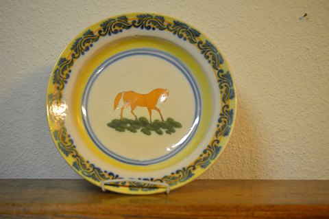 faience dish decorated with horse