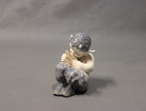 Royal Copenhagen porcelain Pan figurine with flute, no.: 1736.
5000m2 showroom.