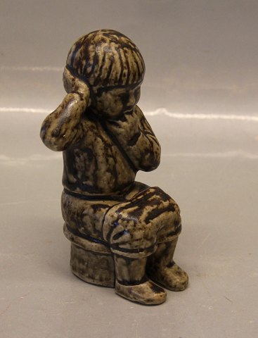 Royal Copenhagen Art Pottery 5395 Boy sitting 15 cm Signed JH for Johannes 
Hedegaard