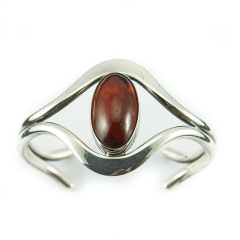 Niels Erik From; 
A bangle in sterling silver with amber