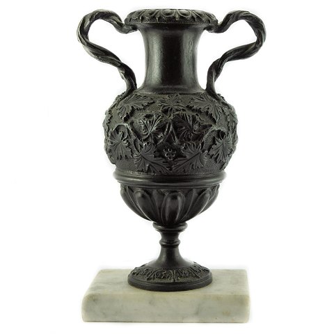 A bronze vase mounted on a marble base, empire around 1810