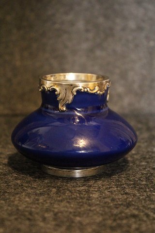 Rare antique little porcelain vase from Royal Copenhagen in blue glaze with 
silver fittings .