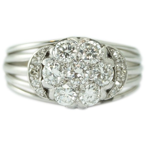 A diamond ring mounted in 14k white gold