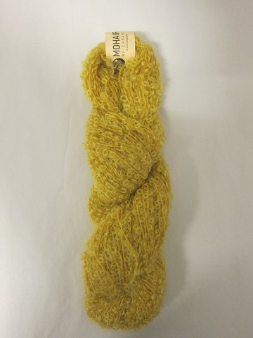 Mohair Bouclé
Mohair Bouclé is a natural product of a very high quality from the angora goat 
from South Africa.
The colour shown is: Curry, Colourno 1034
1 ball of wool containing 100 grams