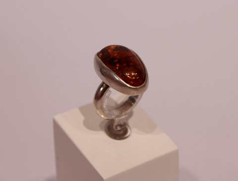 Simpel ring with piece of amber and of silver.
5000m2 showroom.