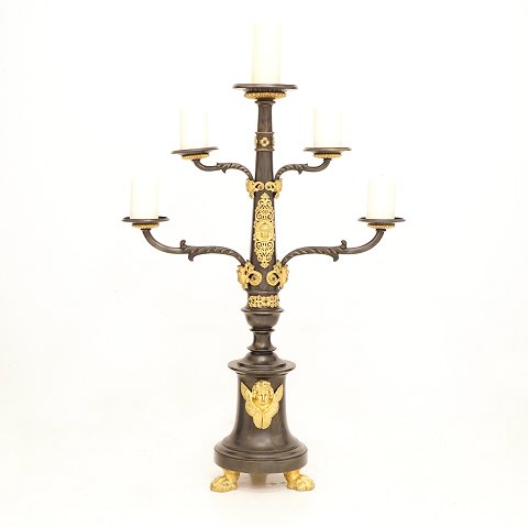 A large gilt bronze candlestick for five candles. 
France circa 1850. H: 95cm. W: 66cm