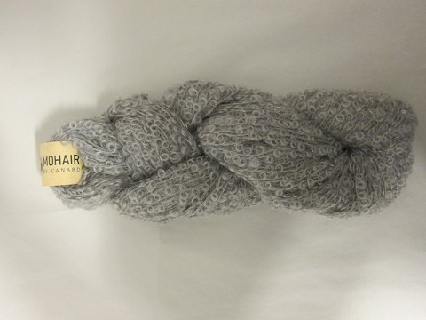 Mohair Bouclé
Mohair Bouclé is a natural product of a very high quality from the angora goat 
from South Africa.
The colour shown is: Silver grey, Colourno 1081
1 ball of wool containing 100 grams