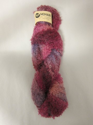 Mohair Bouclé Mix
Mohair Bouclé Mix is a natural product of a very high quality from the angora 
goat from South Africa.
The colour shown is: Forrest Berry Mix, Colourno 1072
1 ball of wool containing 100 grams
