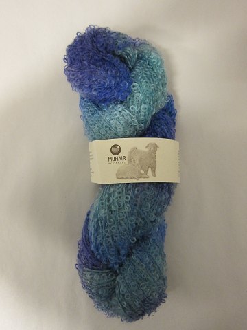 Mohair Bouclé Mix
Mohair Bouclé Mix is a natural product of a very high quality from the angora 
goat from South Africa.
The colour shown is: Cobalt blue Mix, Colourno 1046
1 ball of wool containing 100 grams