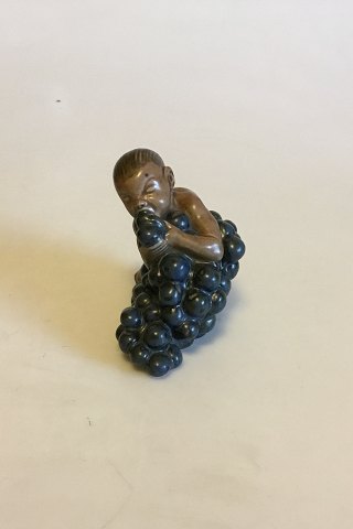 Bing & Grøndahl Figurine by Kai Nielsen "Little Bacchus with Grapes" No 4021 
from  The Grape Harvest Series