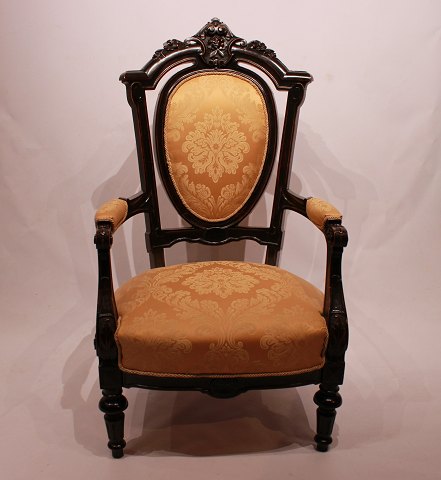 Armchair in the style Rokoko of mahogany and yellow fabric.
5000m2 showroom.