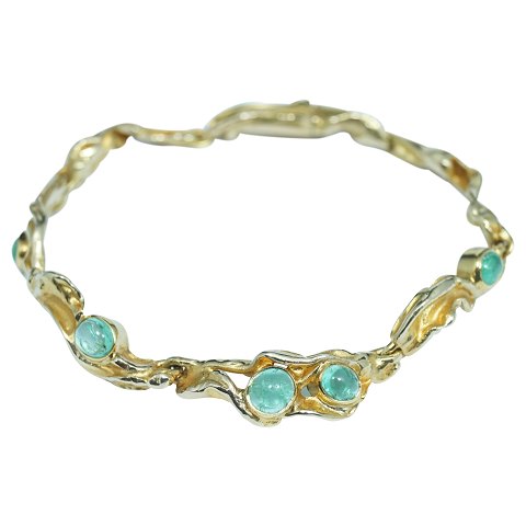 C. Antonsen; A bracelet of 14k gold set with emeralds
