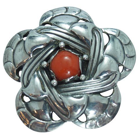 Georg Jensen; An art nouveau silver brooch set with a coral #12, 1904-1908