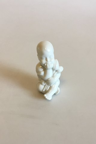 Royal Copenhagen Blanc de Chine Figurine of Baby with flowers