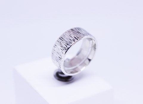 Wide silver ring with pattern.
5000m2 showroom.