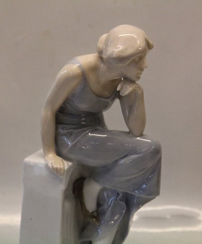 Royal Copenhagen 568 RC Woman on a stone seat 26 cm Axel Locher pre 1910