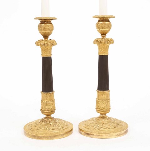 A pair of early 19th century gilt bronze 
candlesticks. France circa 1800. H: 33cm