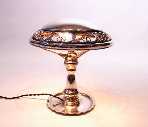 Table lamp of hallmarked silver and beautifully decorated shade.
5000m2 showroom.

