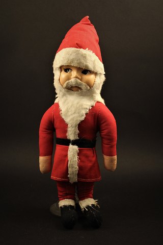 Old Santa Claus Santa Claus in fabric with celluloid face.
Height: 33cm.