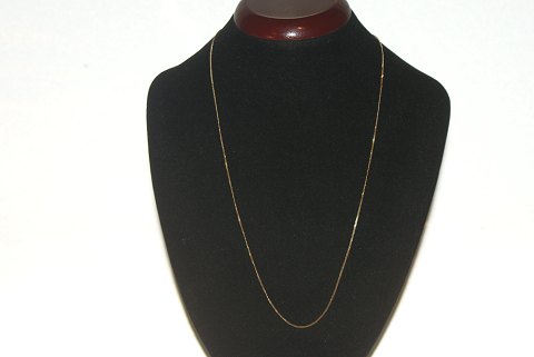 Armored faceted necklace in 14 carat gold