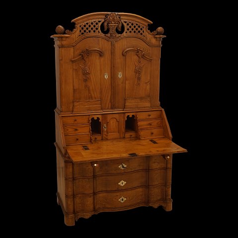 A Danish Louis XVI elm cabinet. Southern Denmark 
circa 1770. H: 201cm. W: 118cm. D: 88cm