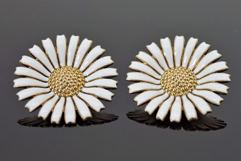 Georg Jensen; A pair of Daisy ear clips of gilt sterling silver and enamel 32 mm
