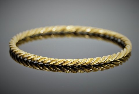 Georg Jensen; A braided bangle of 18k gold #1017A