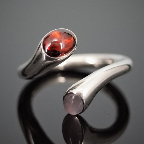 Georg Jensen, Regitze Overgaard; A ring of sterling silver set with a garnet and 
a rose quartz #263