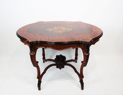 New Rococo pedestal table of walnut with carvings and inlaid intarsia of fruit 
wood from the 1880s.
5000m2 showroom.