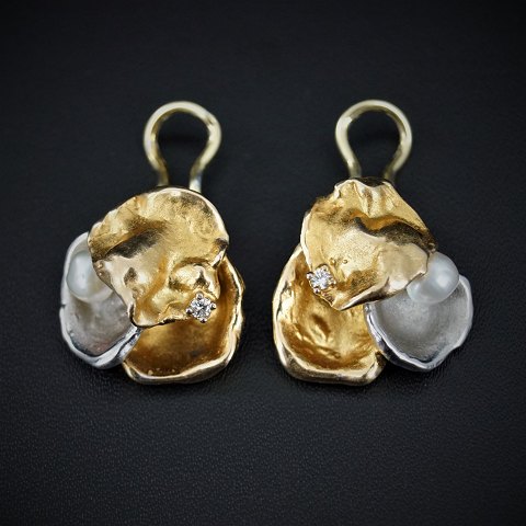 C. Antonsen; Ear clips of 14k gold and white gold set with a pearl and a diamond